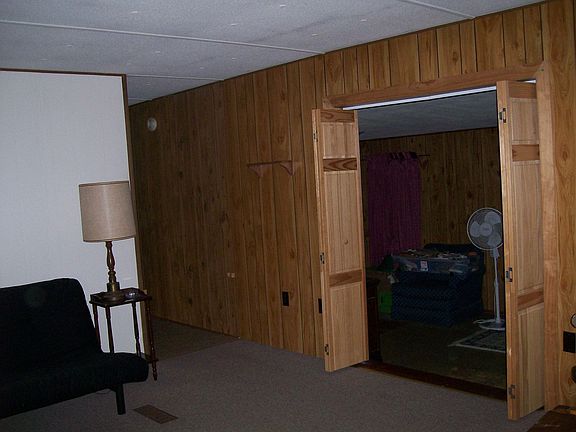 Living room opens in to den w/wood stove