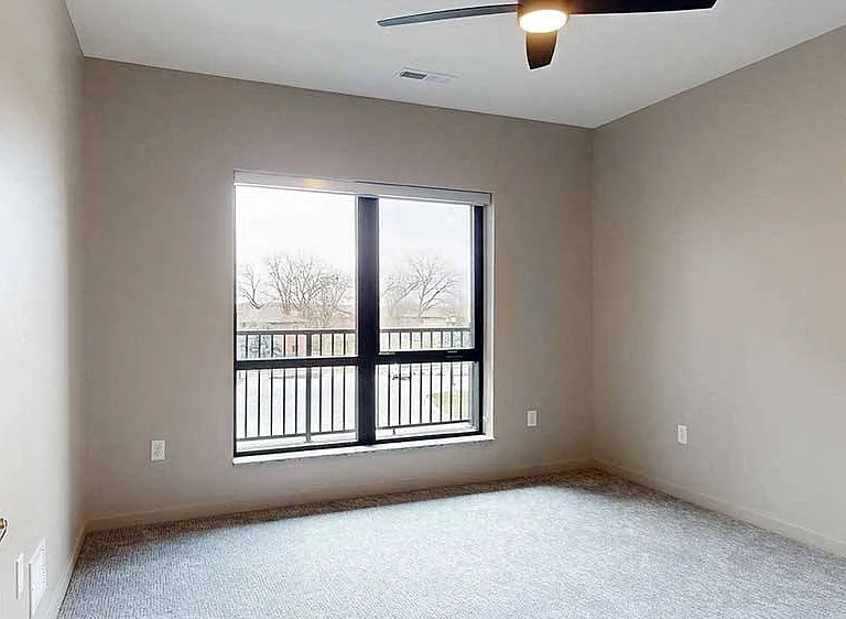 Wake up to stunning viewsthis spacious bedroom features a large window to create a bright and natural feel.