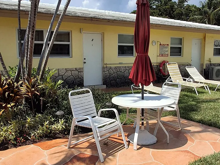 features a private door leading to the pool