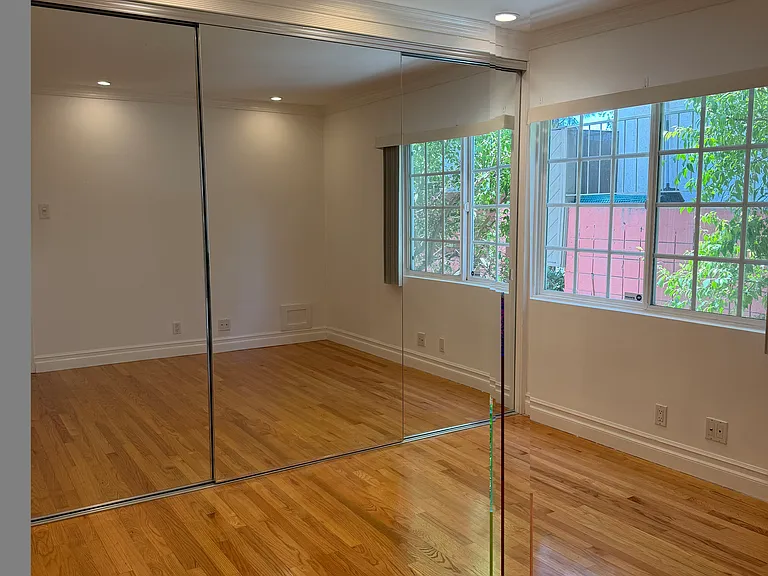 BEDROOM HAS LARGE WINDOW WITH LOTS OF NATURAL LIGHT