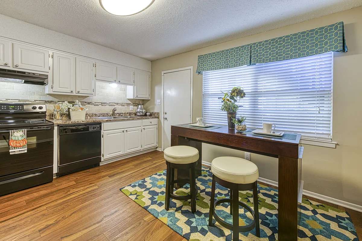 Kitchen with Wood-style Floors - Ascent Jones Valley