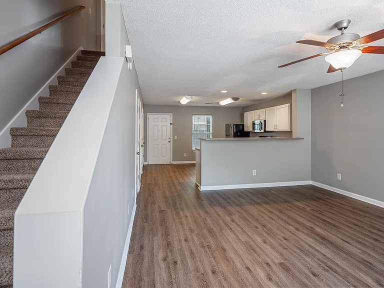 Spacious living room with hardwood-style flooring