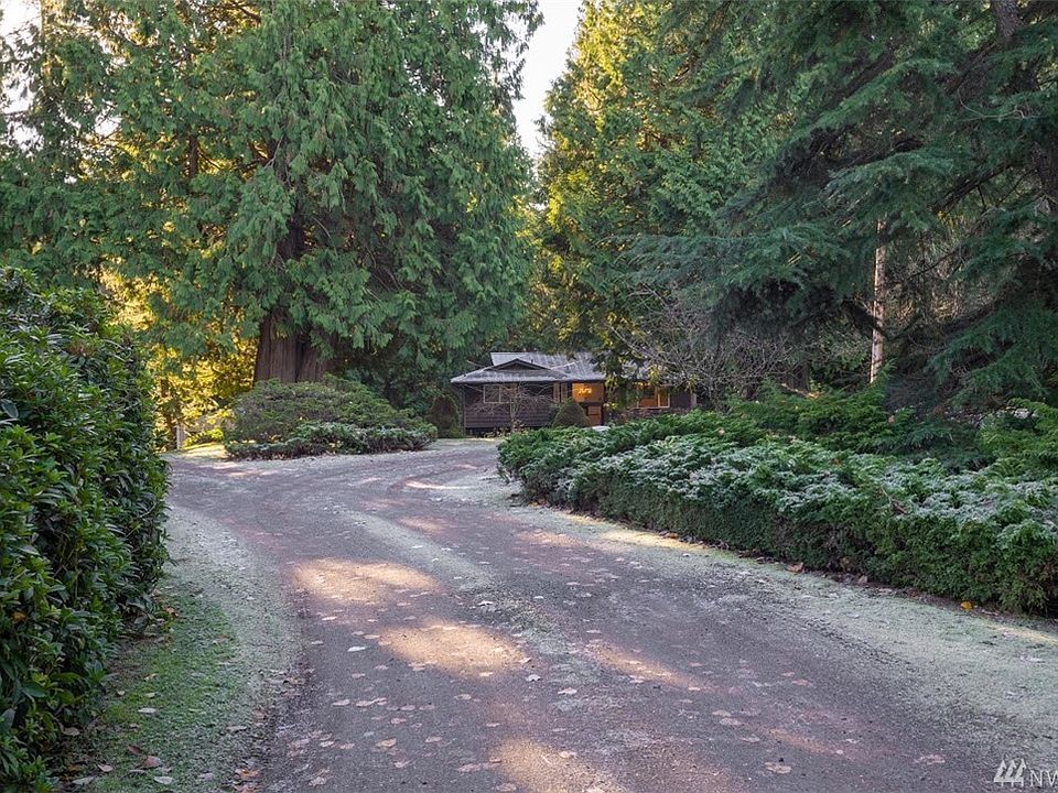 PRIVATE, TRANQUIL, HOME ON ACERAGE SURROUNDED BY 85 YEAR OLD CEDAR TREES !