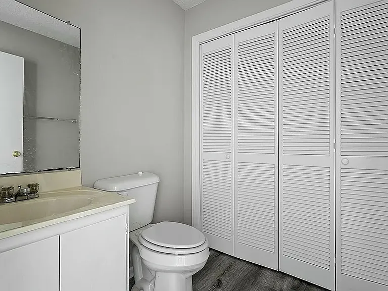 Convenient half bathroom with an adjacent laundry area for easy everyday use.