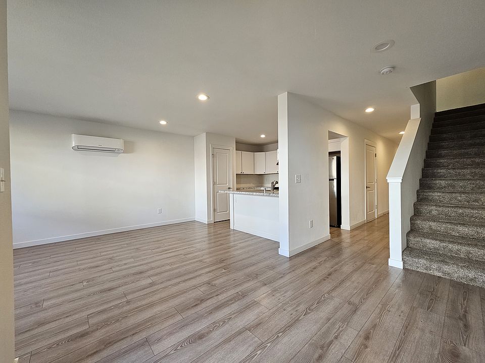 View of the kitchen and living room with the ductless heat pump.