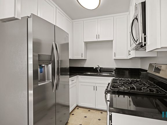 Kitchen with Energy-Efficient Appliances and Cabinet Storage