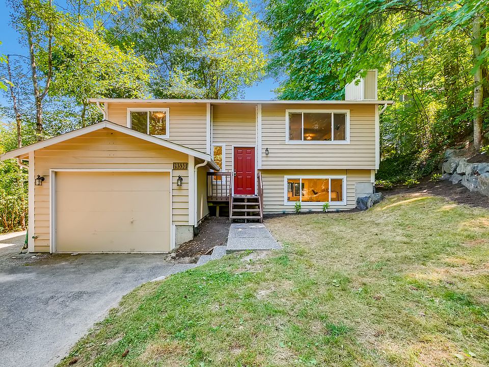Front of home with garage, large front yard and ample off-street parking.