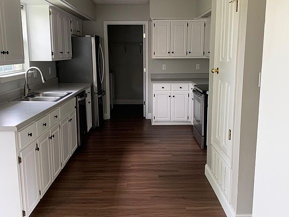 Pretty bright and clean kitchen with sink window facing lovely fenced backyard