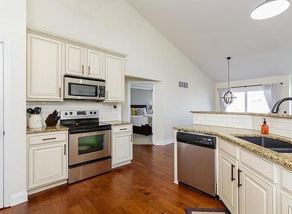 Kitchen with Granite Countertops and Breakfast Bar