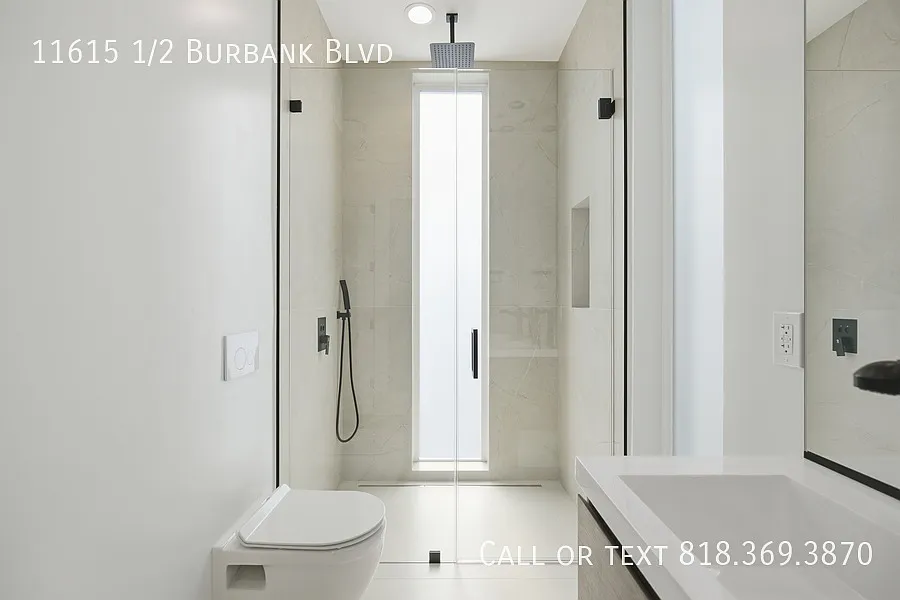 A Sleek Two-Bedroom With Two Parking Spots — Photo 3