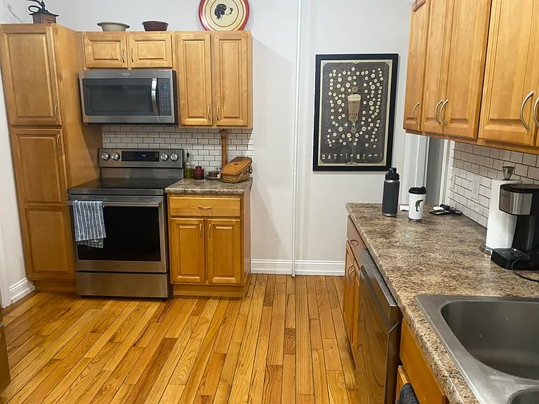Kitchen w/Tenant Furnishings & New Stove