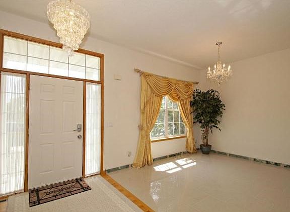 A beautiful foyer is just the beginning of this professionally decorated home. No expense was spared in making this an elegant yet exciting interior.
