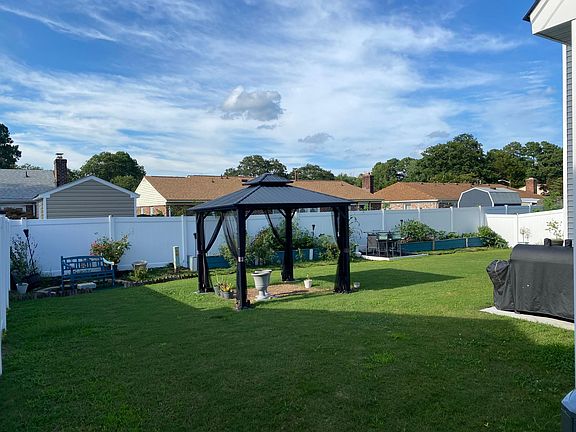 Backyard area with Gazebo and grilling area