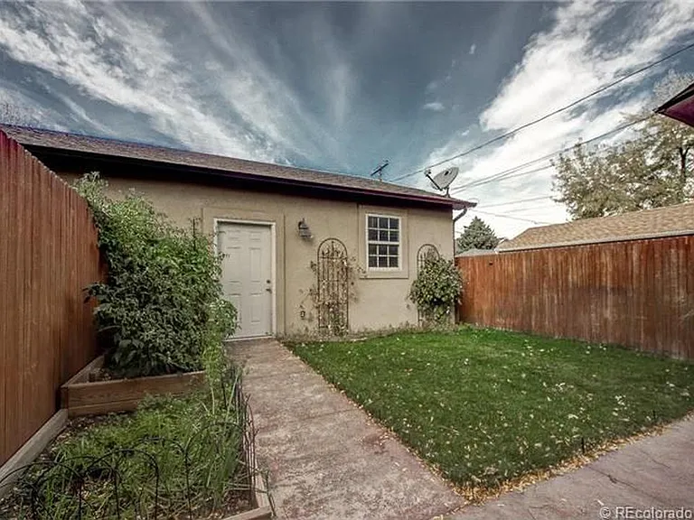 Garden and grass area and 2-Car Garage.