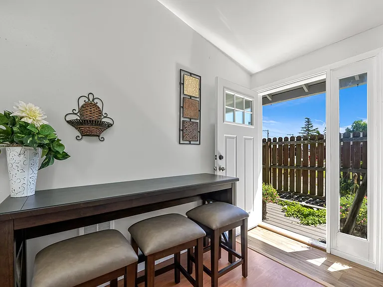 office space in the master bedroom with exterior door to the rock garden