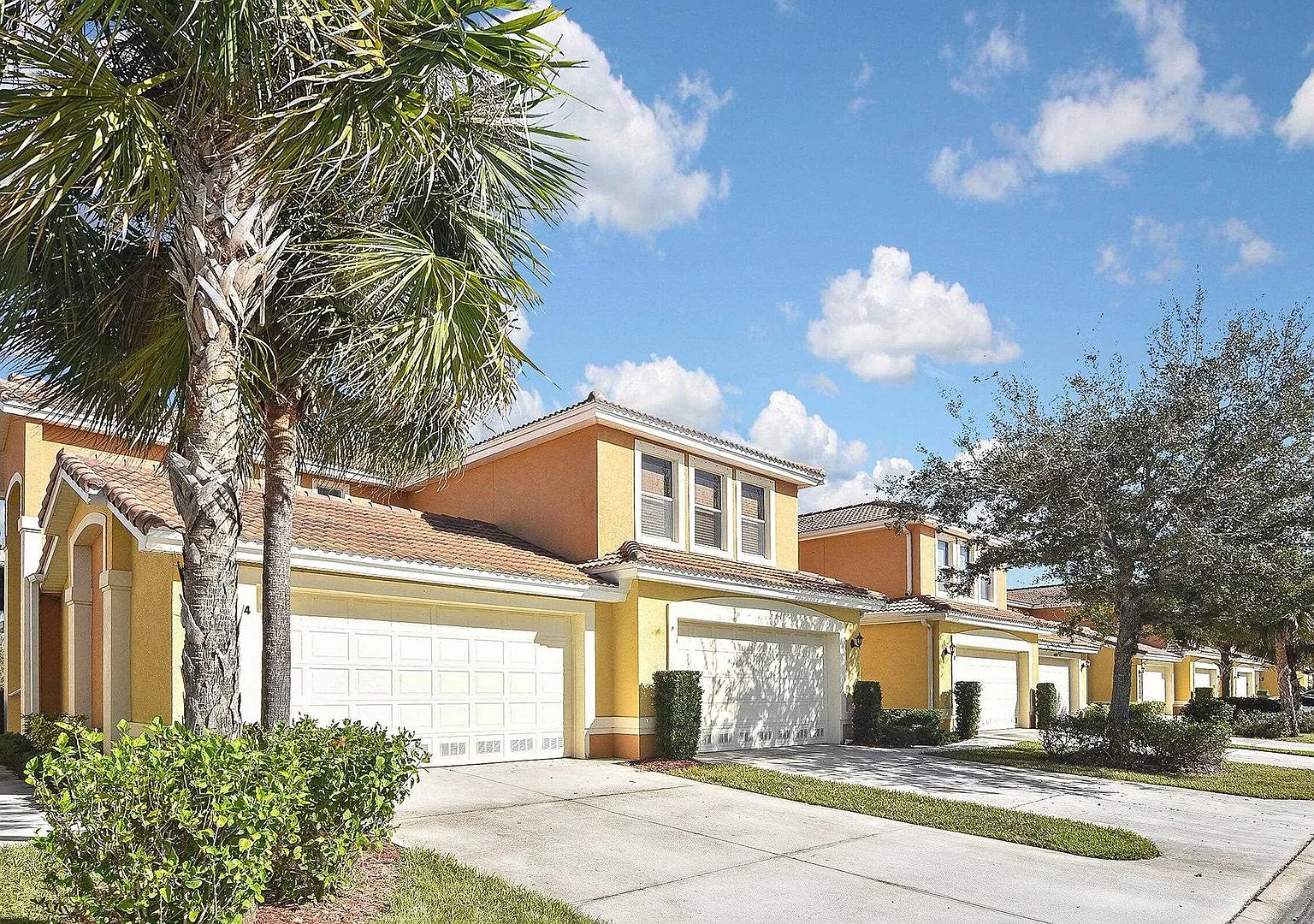 4BR/3BA Fort Myers Coach Home with Lake View & 2-Car Garage $2,400/mo — Photo 1