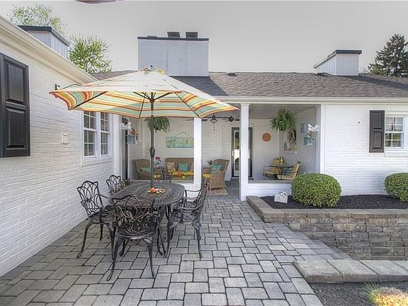 The upper patio and covered back porch offer options to enjoy the outdoors.