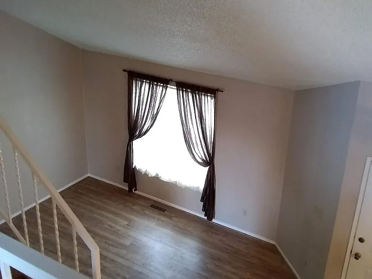View of living room looking down from upstairs.