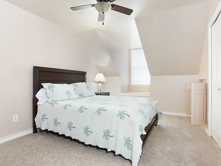 Guest bedroom 2 upstairs with ceiling fan.
