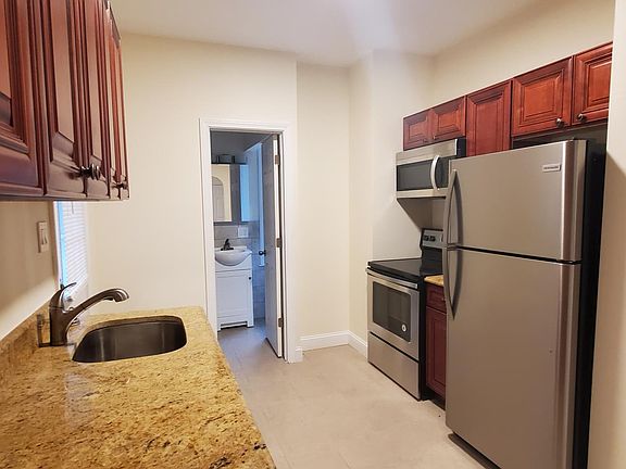 Kitchen Facing BackDoor & Bathroom