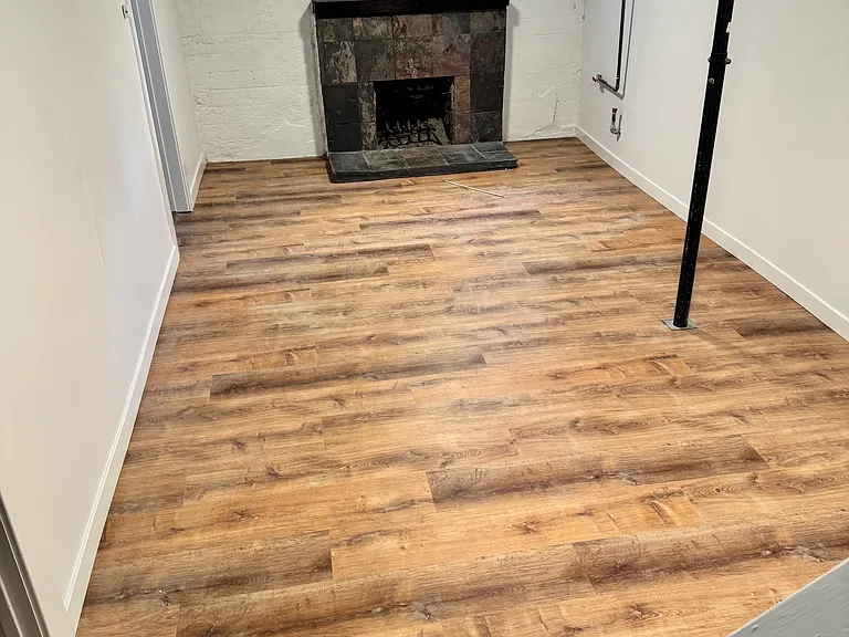 Finished Basement with another smaller room and egress window.