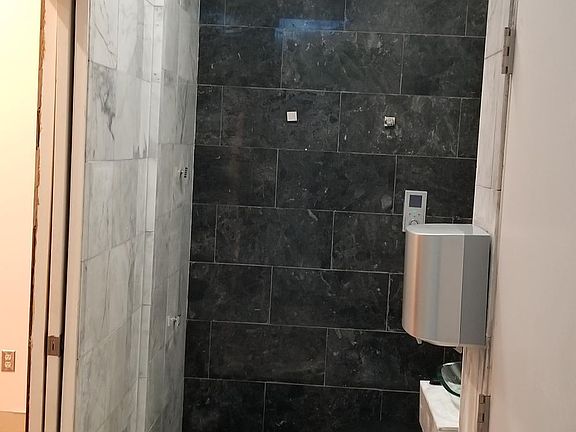 HIgh tech Bathroom, recently upgraded, commode requires flip of switch before use