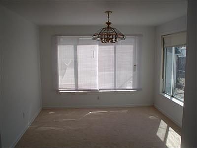 TWO LARGE WINDOWS MAKE THIS A CHEERFUL DINING ROOM.