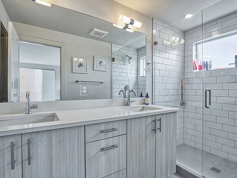 Bathroom with double sinks ensuite in primary
