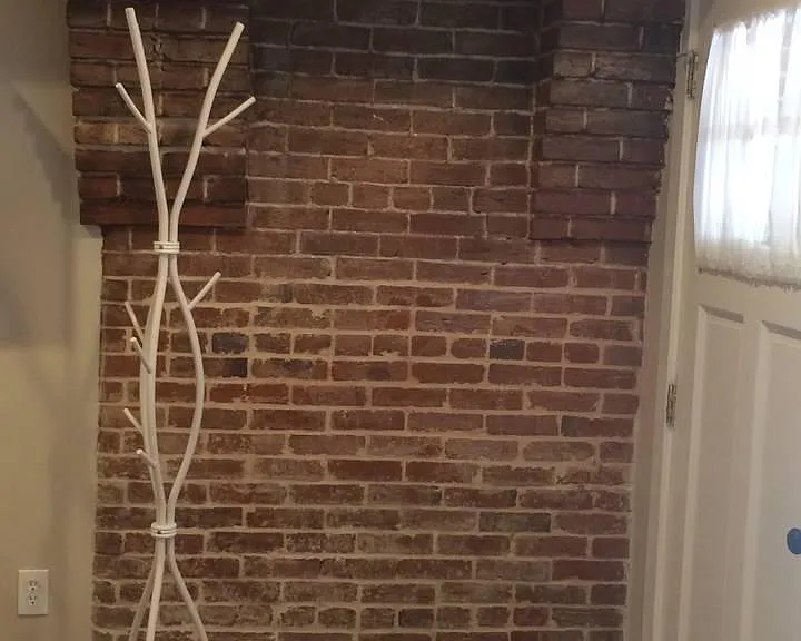 Exposed bricks in entry hall