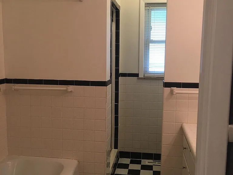 Hall Bath with full sized tub and Shower.