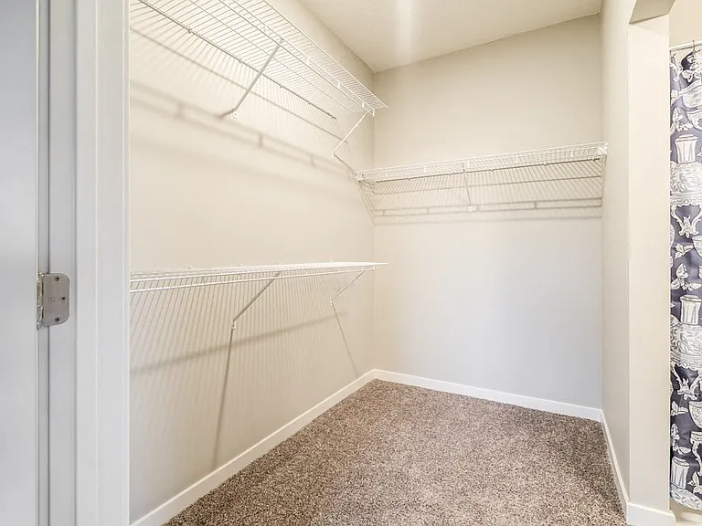 Spacious walk-in closets provide plenty of room to keep your wardrobe organized and accessible.