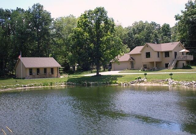 Street view of the house and pond