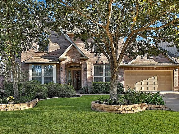 Mature trees and landscaping, stone lined flower beds and full sprinkler system. Full brick exterior and sidewalks in this section of the neighborhood makes it easy to walk to this sections pool, picnic area and playground.