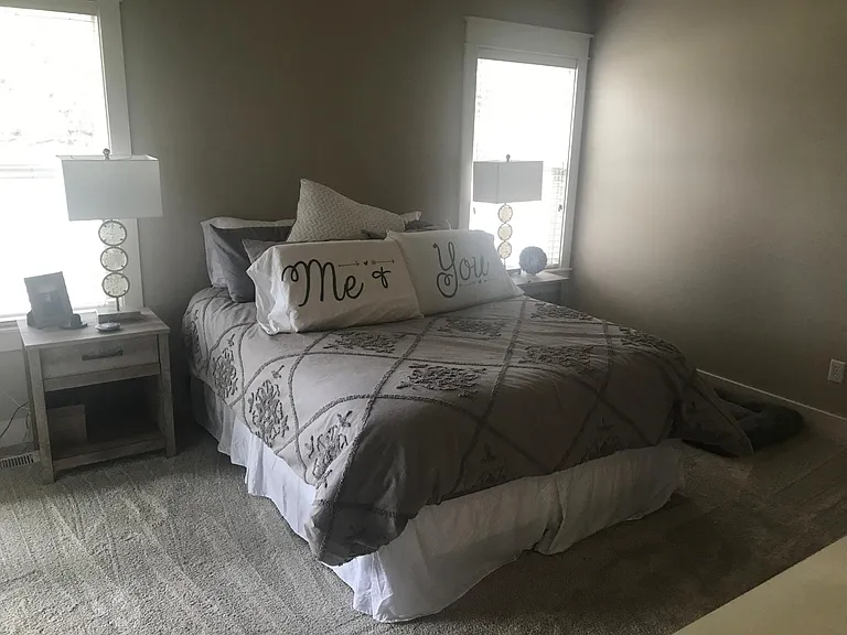 Master bedroom with attached bathroom and walk in closet