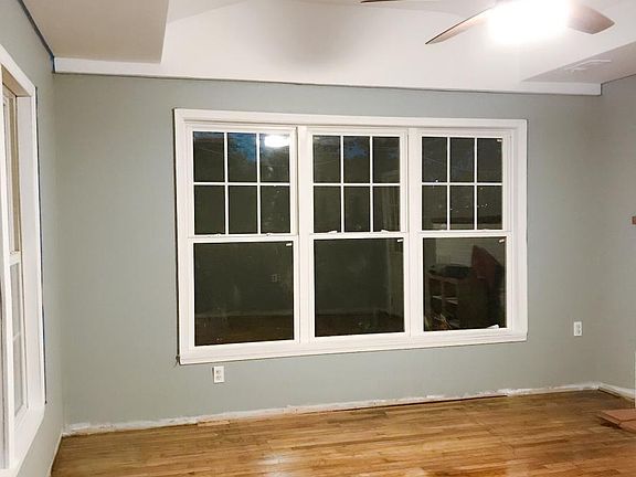 Sunroom with refinished hardwood floor