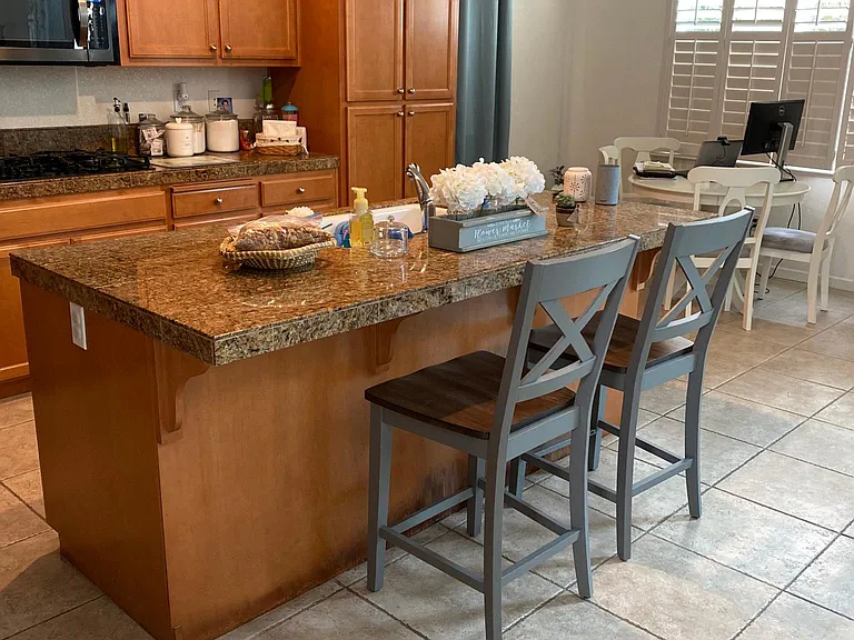 Kitchen island is open concept to the family room