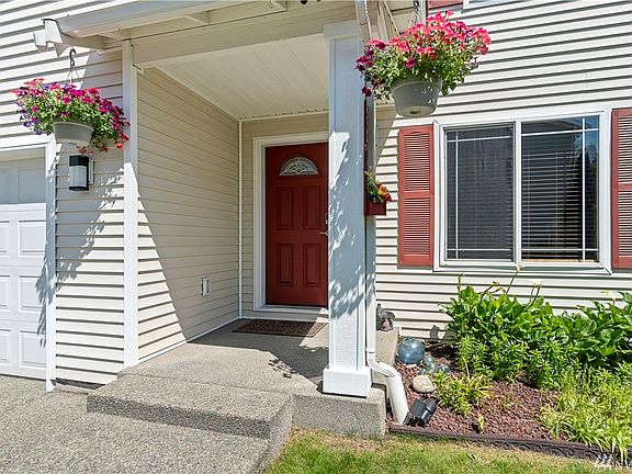 Nice landscaping with front yard sprinklers