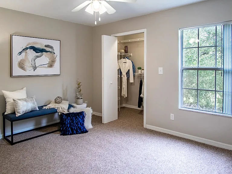 Step into a classic retreat at Eagle's Pointe the master bedroom oasis. Embrace dreams and relaxation with a walk-in closet and a multi-speed ceiling fan.