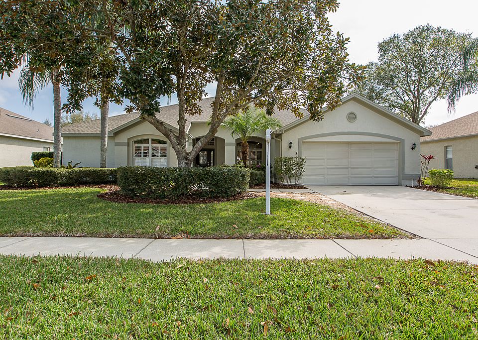 Front shows lush landscaping