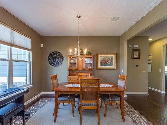 Dining room with lots of natural light, and hardwood flooring.