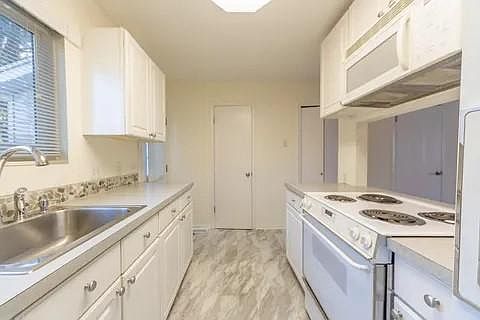 Kitchen looking towards half bath.