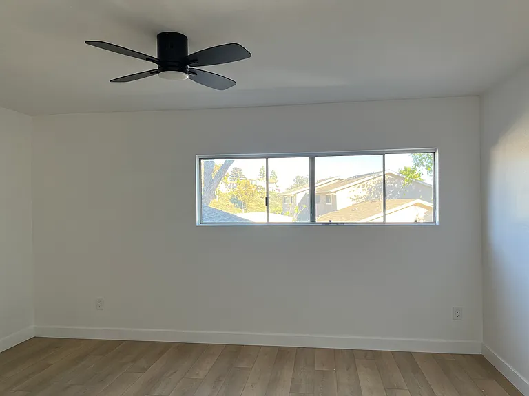 The largest of the three bedrooms, includes walk-in closet.