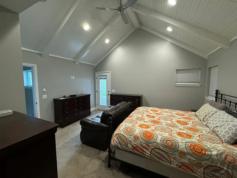 View into Primary Bedroom from walk-in closet