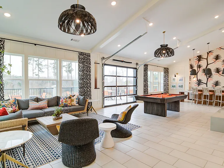 Resident lounge with billiards and kitchen area
