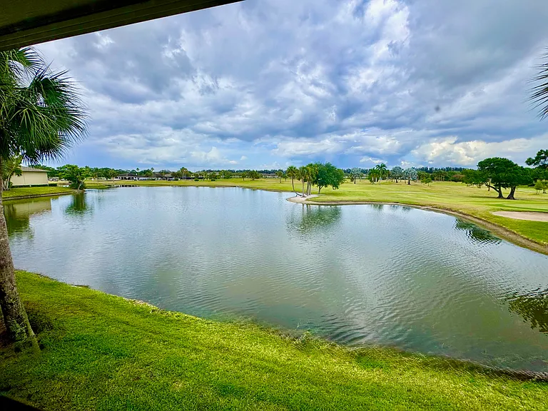 STUNNING expansive lake & golf course views to enjoy from the comfort of your bed!