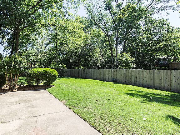 Private wooded Backyard backs to neighboring creek.