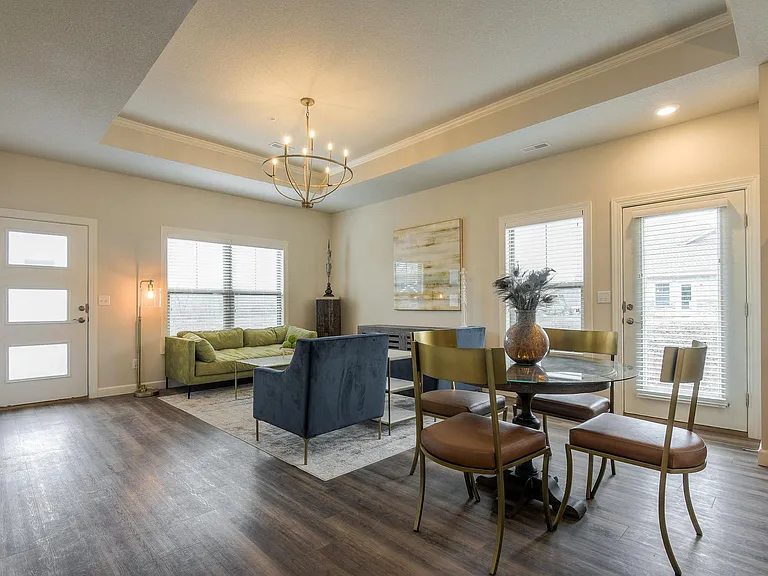 The Torrance- Dining and Great Room/Living Area Located at the Front of the Villa w/ access to a Private Patio