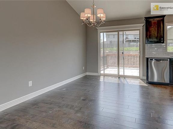 Prefinished wood flooring in kitchen, entry and breakfast. Sliding glass door leads out to spacious deck.