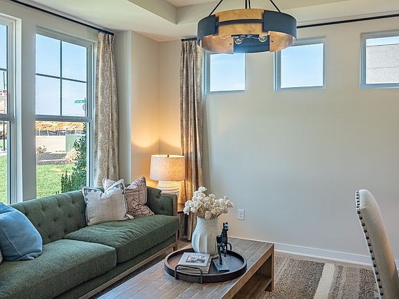 Study and sitting area with 5 total windows letting in natural light