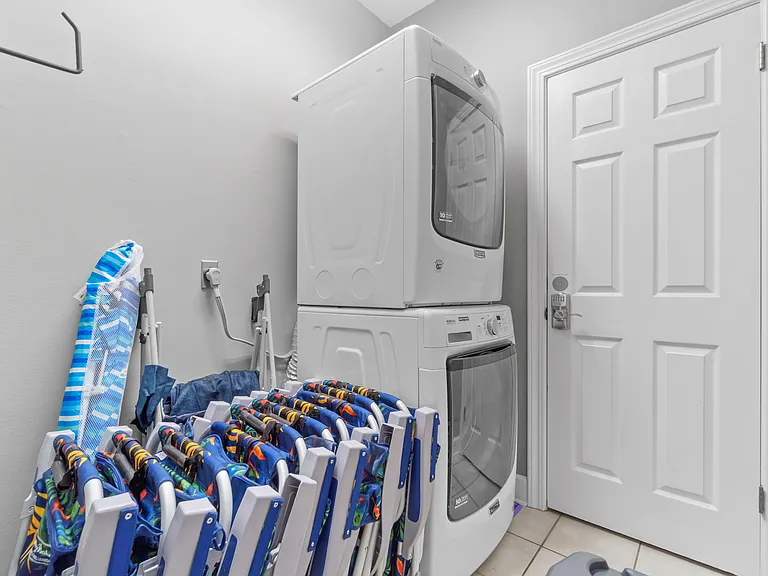Laundry area. The beach gear is now behind the house in a bin.